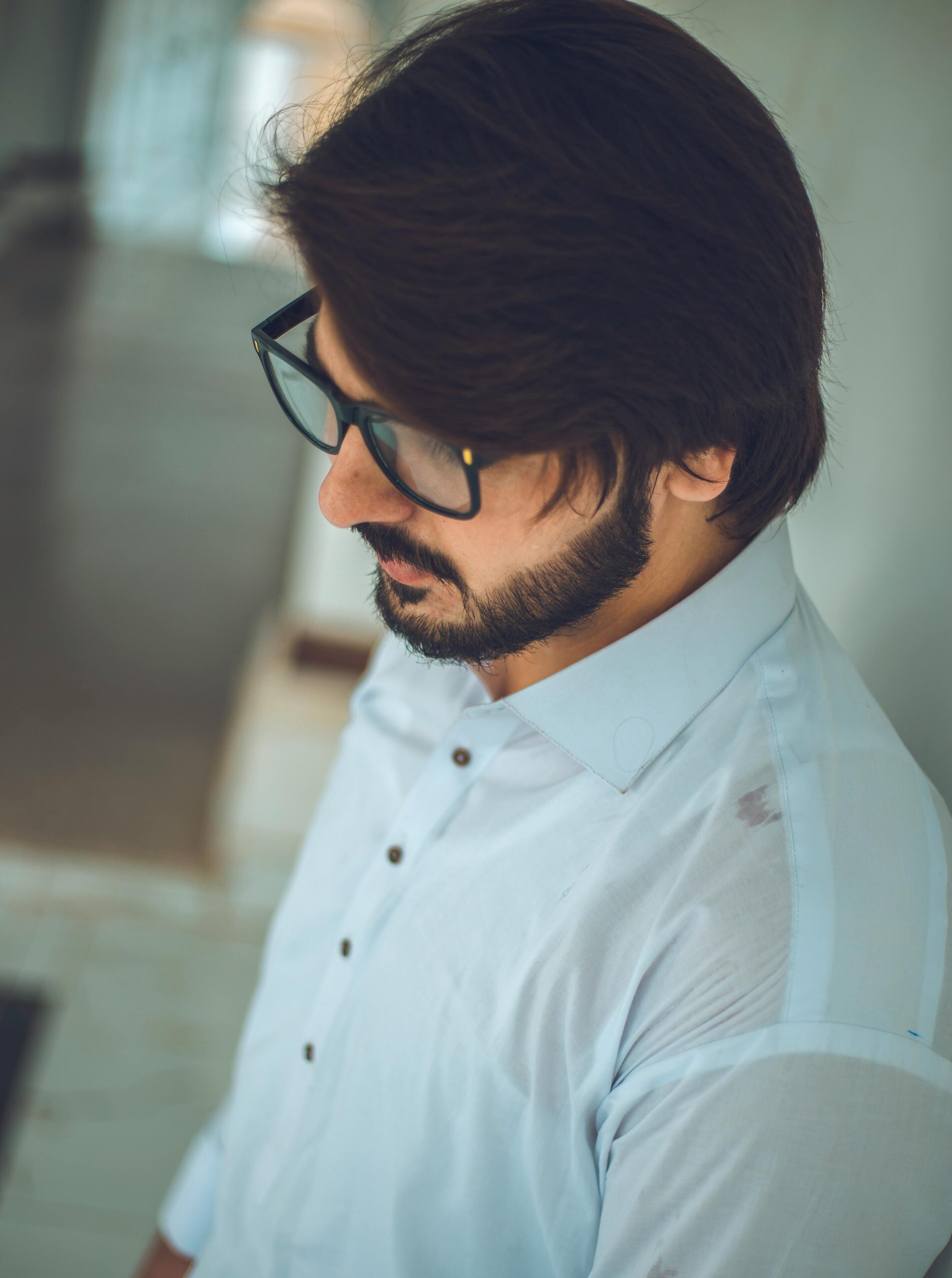 Side view portrait of a thoughtful man with glasses in Kohat, Pakistan.